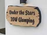 Custom engraved wooden house sign close up showing natural oak grain and black lettering