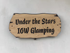 Rustic solid oak outdoor sign with live edge detail mounted on rendered wall