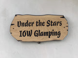Rustic solid oak outdoor sign with live edge detail mounted on rendered wall