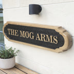 Oak house name plaque mounted beside front door