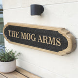 Oak house name plaque mounted beside front door