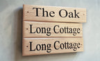 Bespoke wooden house signs installed at home entrance