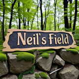 Neil’s Field personalised oak lodge name sign outdoors
