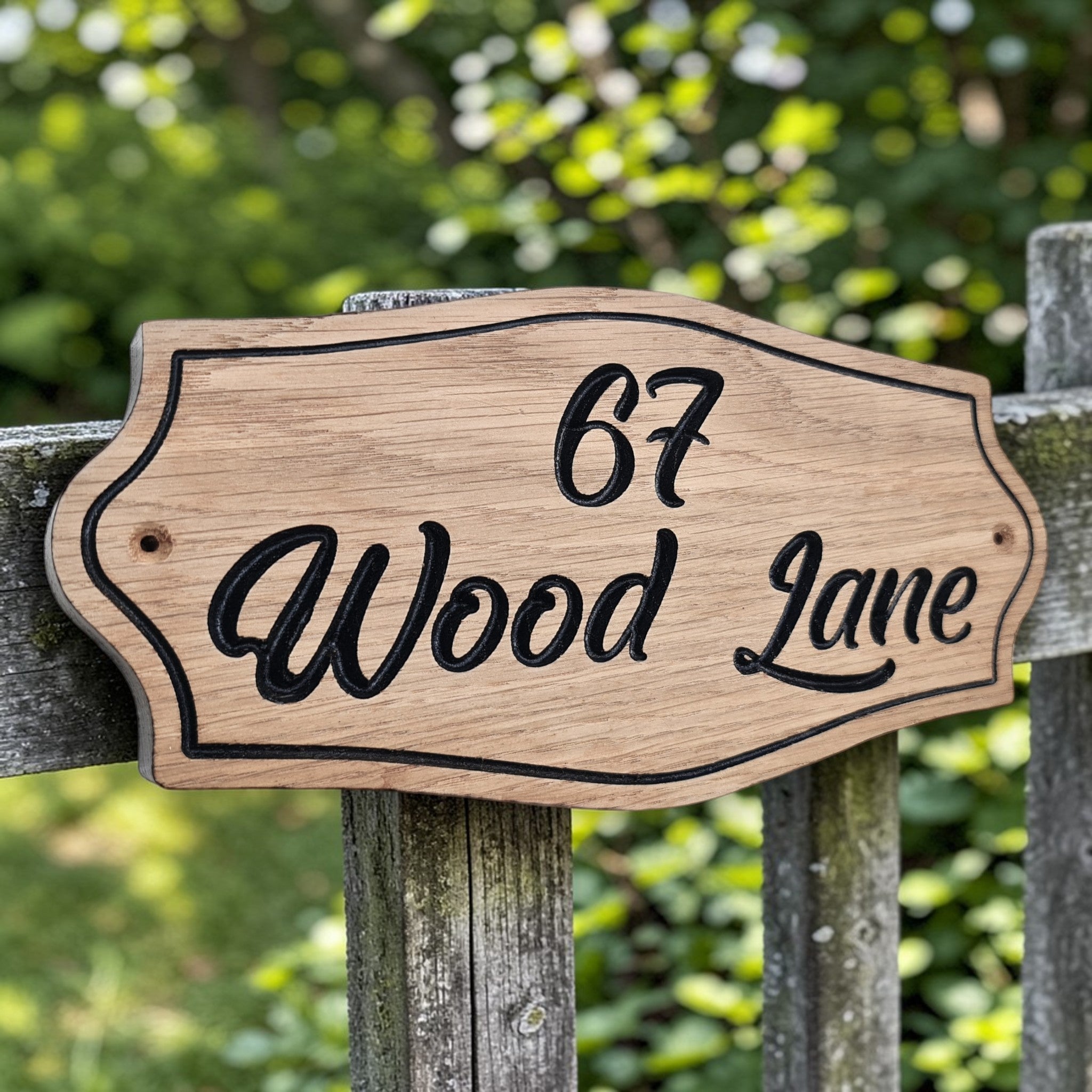 Oak house sign mounted on garden gate