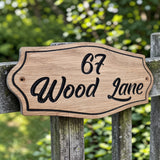 Oak house sign mounted on garden gate
