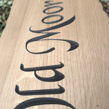 Close up detail of engraved oak lettering texture