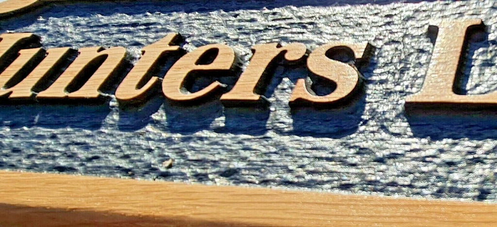 Macro detail of engraved lettering and textured black background