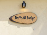 live edge wooden house sign mounted