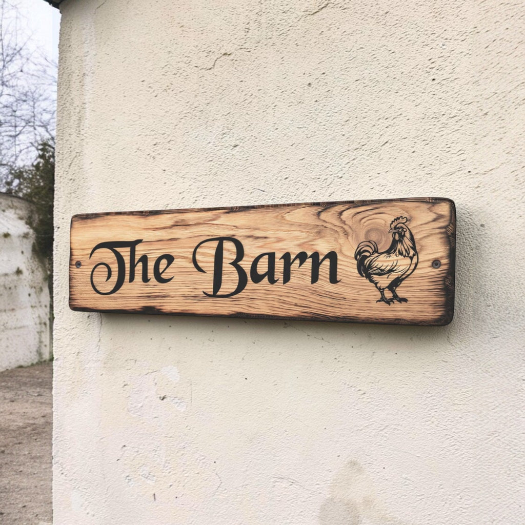 Personalised oak barn sign with engraved rooster mounted on exterior wall