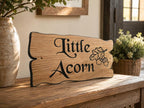 Personalised solid oak cottage sign with decorative engraving displayed indoors