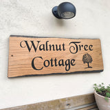 Walnut Tree Cottage personalised rustic oak house sign mounted on wall