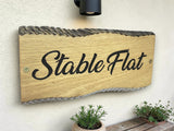 Personalised oak wooden house sign with garden background UK handmade exterior plaque