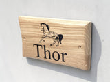 Side view of handcrafted oak dog kennel plaque showing natural wood grain