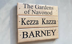 Outdoor oak door sign with custom engraved name